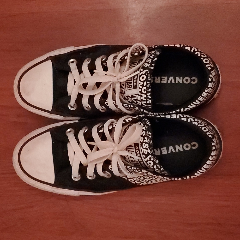 Black and white converse with converse written on the side design